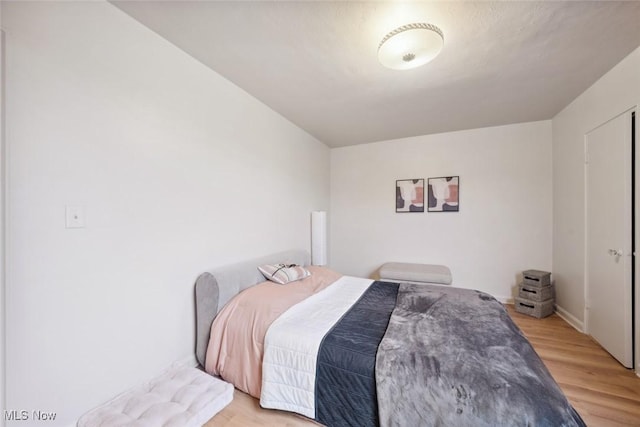 bedroom with light wood-type flooring