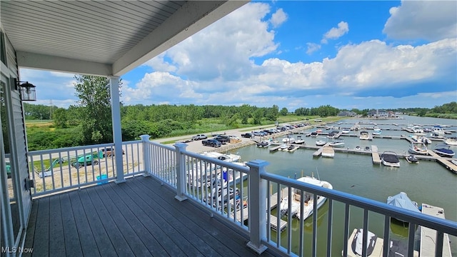 wooden deck featuring a water view