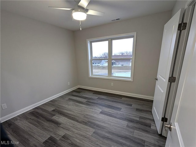 interior space with dark hardwood / wood-style floors and ceiling fan