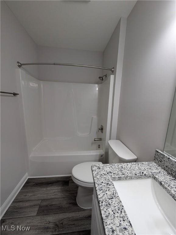 full bathroom featuring shower / bathtub combination, vanity, toilet, and hardwood / wood-style floors