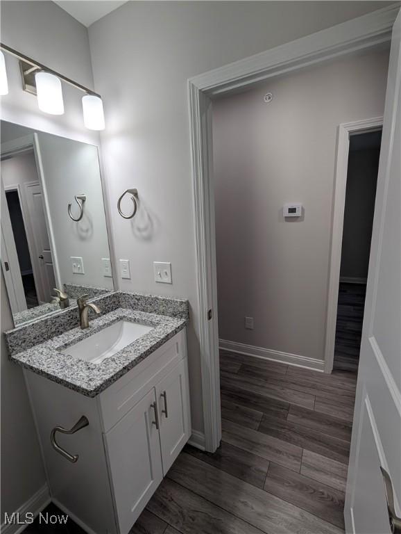 bathroom featuring vanity and hardwood / wood-style flooring