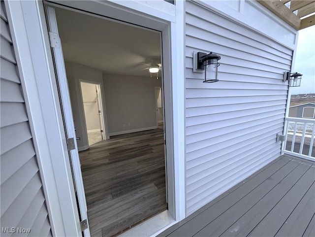 view of exterior entry with a balcony