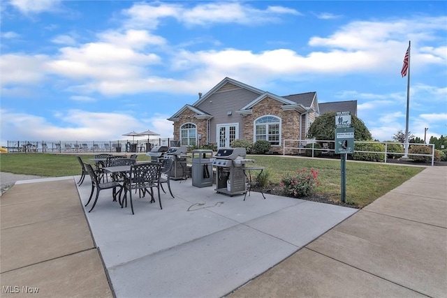 exterior space with grilling area and french doors