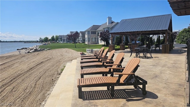 view of community featuring a gazebo and a water view