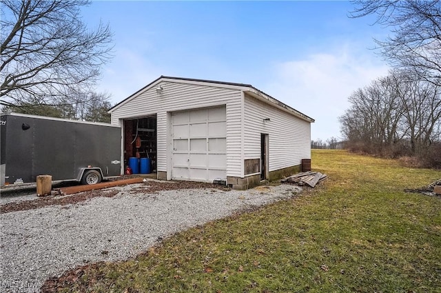 garage featuring a lawn