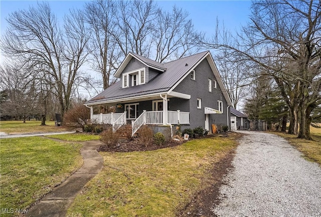 view of front of house with a front lawn and covered porch