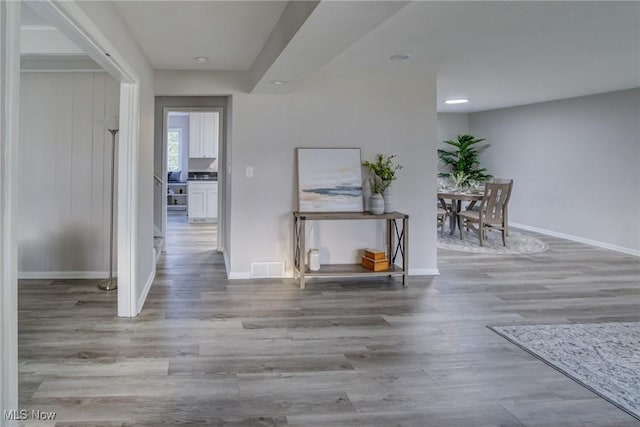 hallway with light hardwood / wood-style flooring