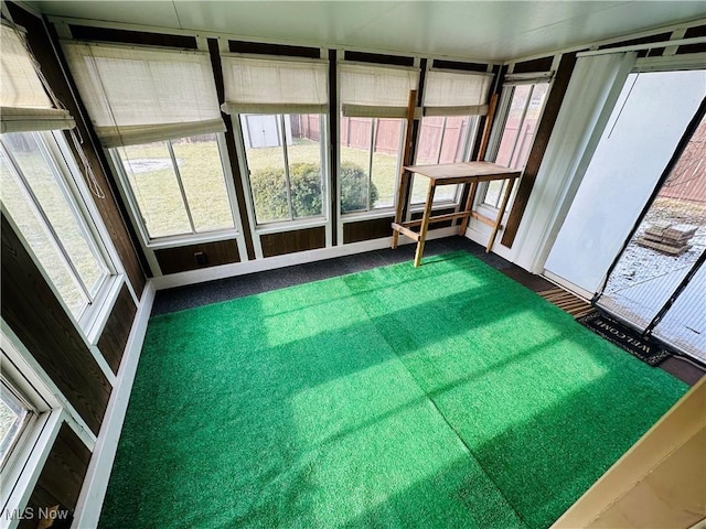 unfurnished sunroom with a wealth of natural light