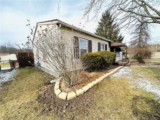 view of property exterior with a lawn