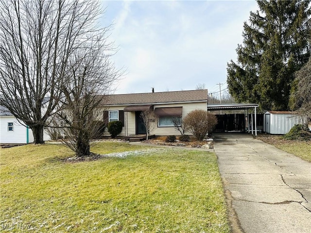 ranch-style home with a storage shed, a front lawn, and a carport