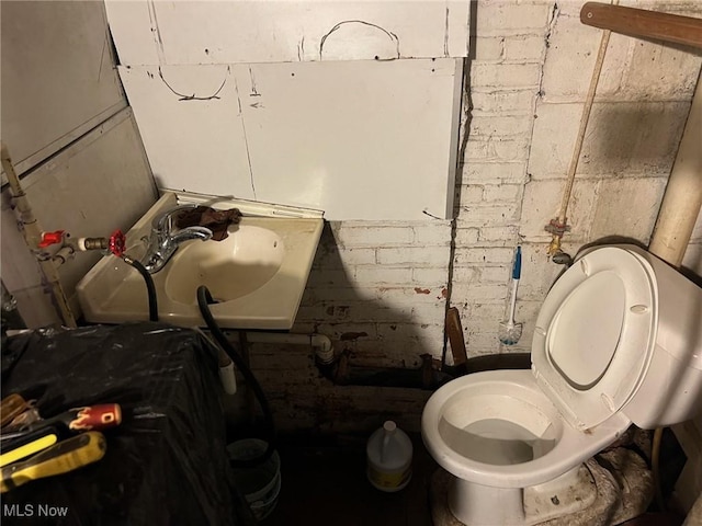 bathroom with toilet and sink