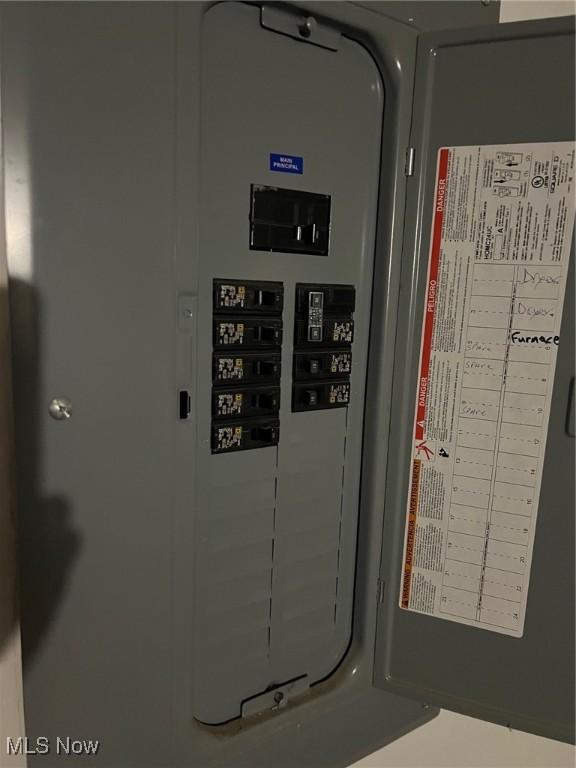 utility room featuring electric panel