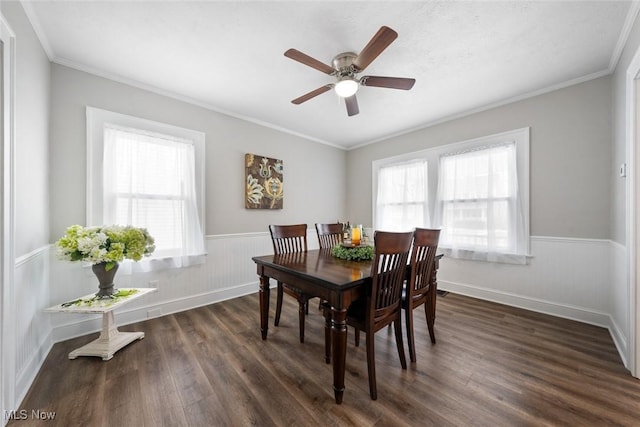 dining space featuring crown molding, plenty of natural light, dark wood-type flooring, and ceiling fan