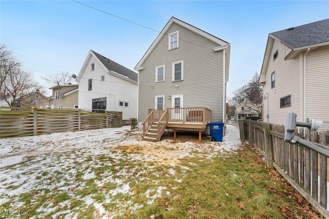 back of house with a wooden deck