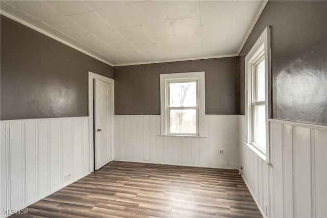 unfurnished room with wood-type flooring