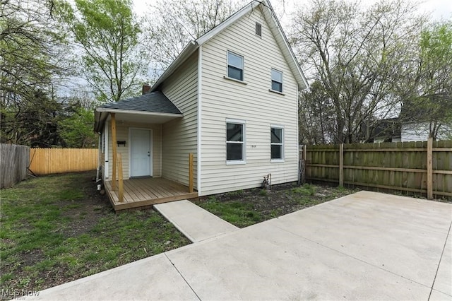 rear view of property featuring a patio