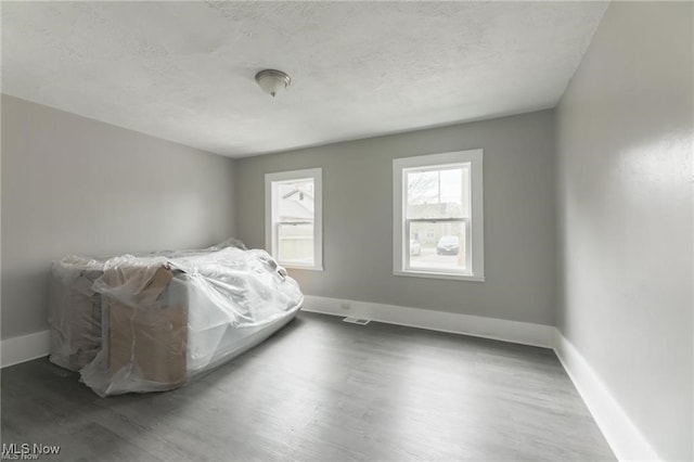 bedroom with hardwood / wood-style flooring