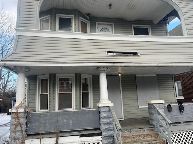 doorway to property featuring covered porch