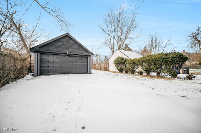 view of snow covered garage