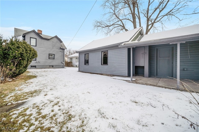 view of snow covered property