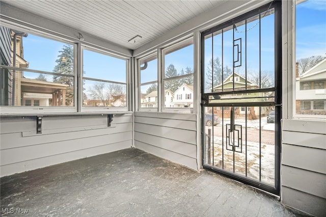 unfurnished sunroom with plenty of natural light