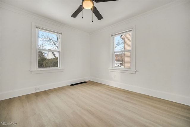 unfurnished room with ornamental molding, ceiling fan, and light hardwood / wood-style flooring