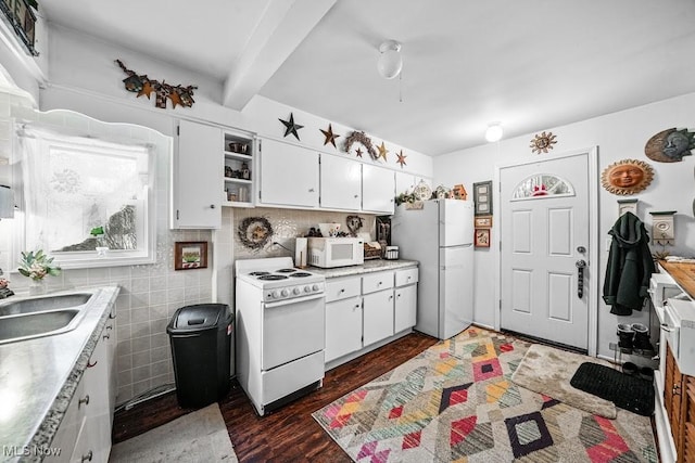 kitchen featuring dark wood-type flooring, sink, white cabinetry, beamed ceiling, and white appliances