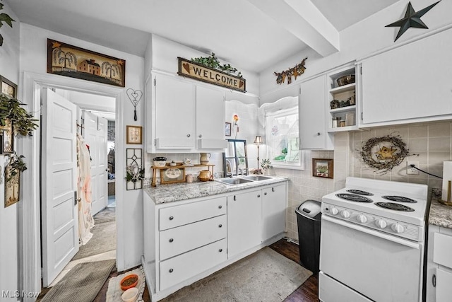 kitchen featuring tasteful backsplash, white cabinetry, sink, and white range with electric cooktop