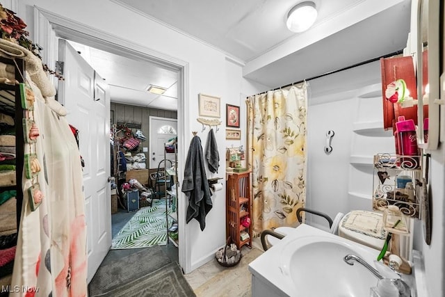 bathroom with a shower with shower curtain and sink