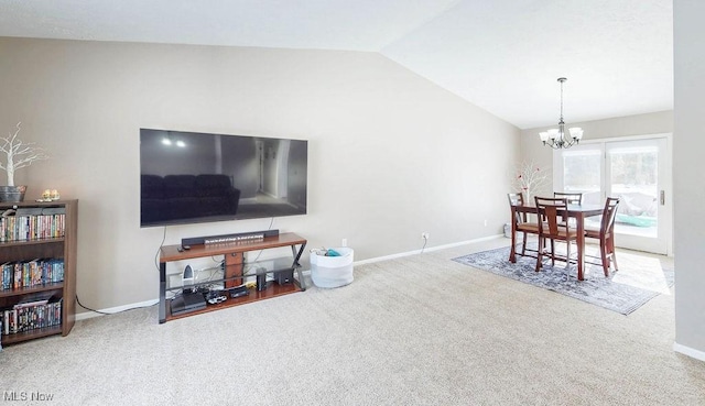 carpeted living room with vaulted ceiling and a chandelier