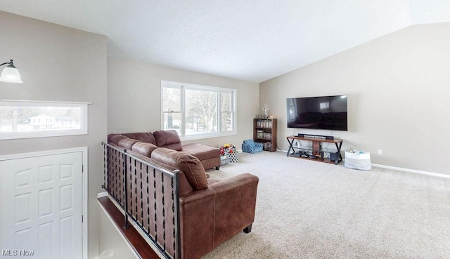 living room with vaulted ceiling and carpet