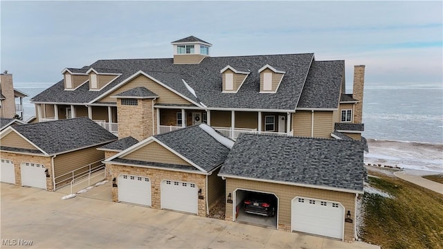 view of front of house with a water view