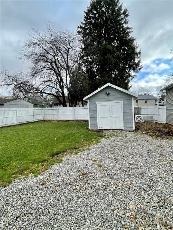 garage with a lawn