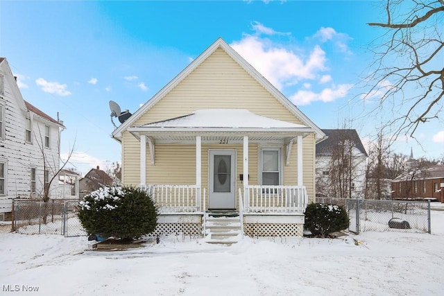 view of front facade with fence and a porch