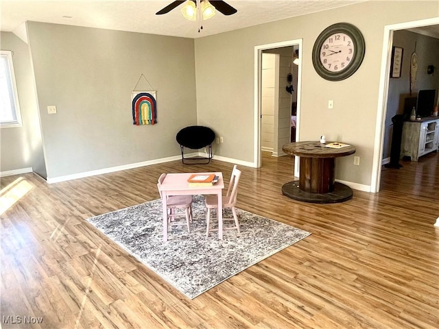 dining area with ceiling fan, wood finished floors, and baseboards