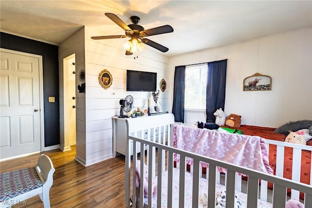 bedroom featuring ceiling fan and wood finished floors