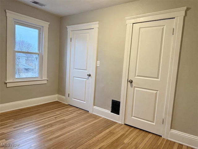 unfurnished bedroom featuring light hardwood / wood-style floors