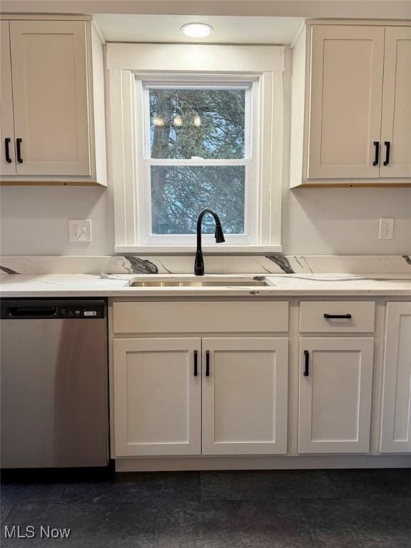 kitchen with dishwasher, sink, and white cabinets