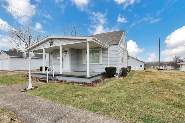 view of front of property featuring a front yard and covered porch