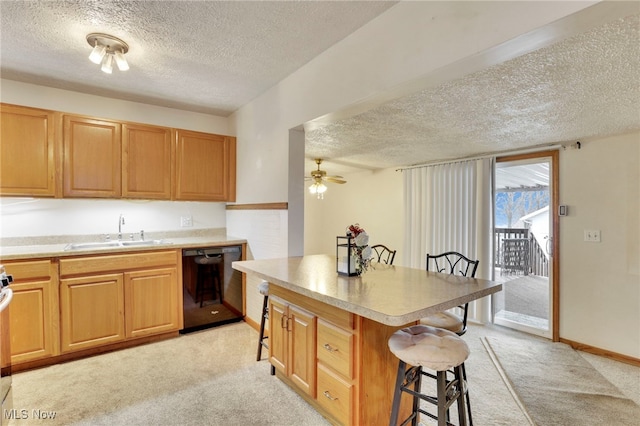 kitchen with sink, a textured ceiling, a kitchen breakfast bar, black dishwasher, and light colored carpet