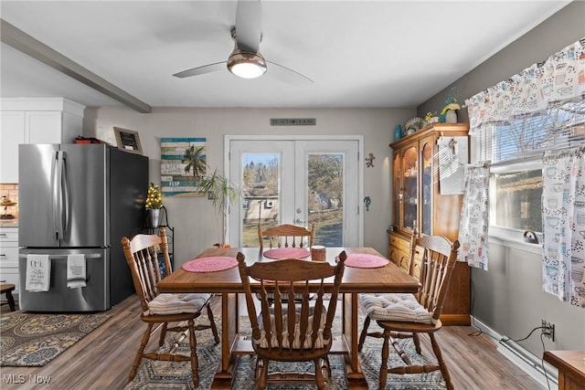 dining room with french doors, ceiling fan, and light hardwood / wood-style floors