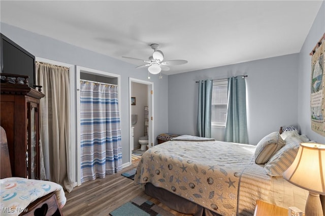 bedroom with ensuite bath, wood-type flooring, and ceiling fan