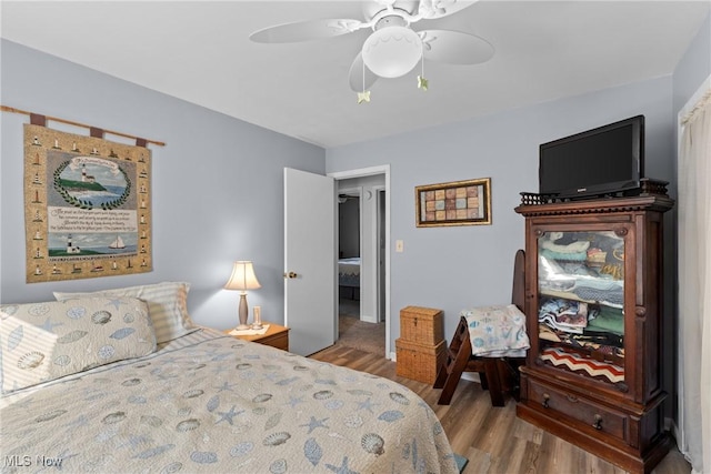 bedroom featuring ceiling fan and light wood-type flooring