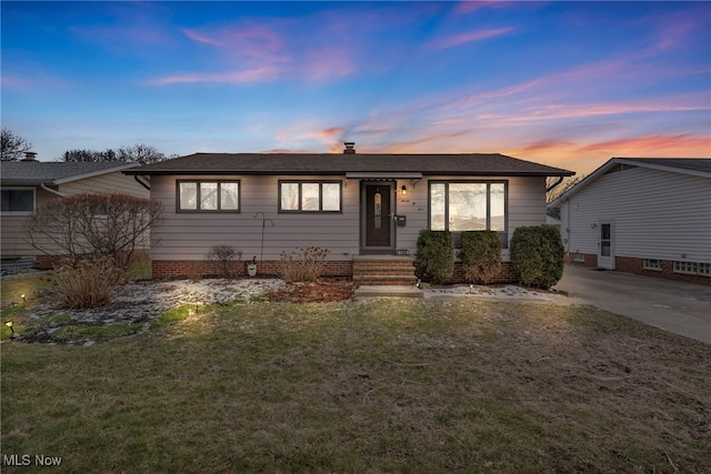 view of front of property with a lawn