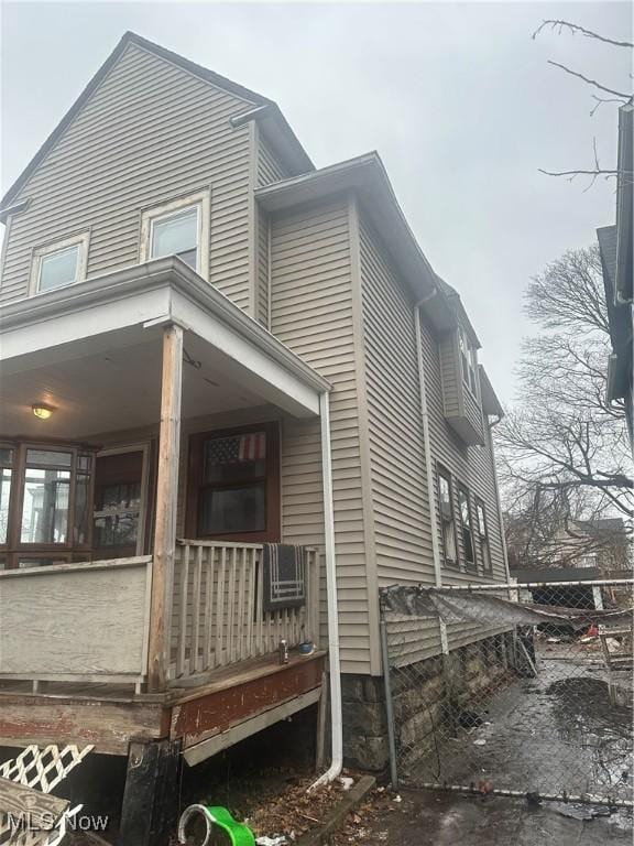 view of side of property featuring a porch