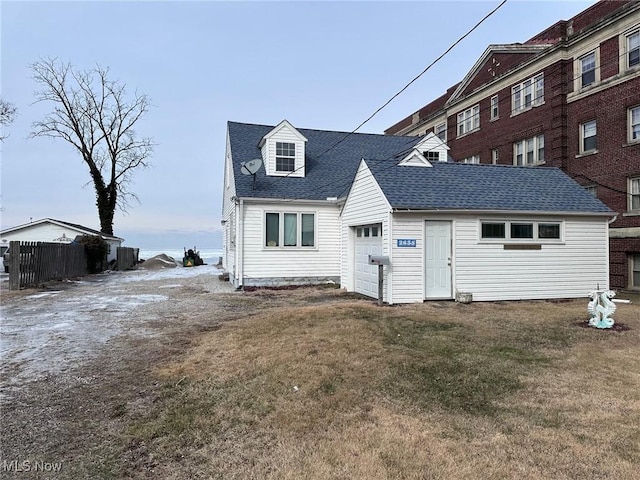 rear view of house featuring a lawn