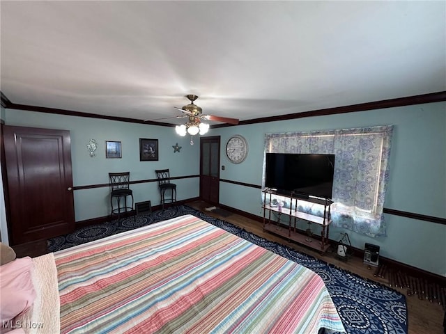 bedroom with crown molding, wood-type flooring, and ceiling fan