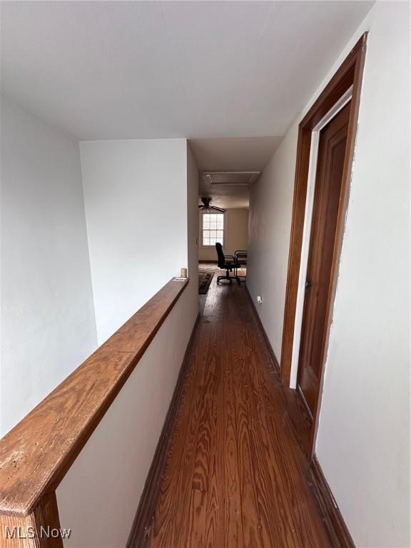 hallway with dark wood-type flooring