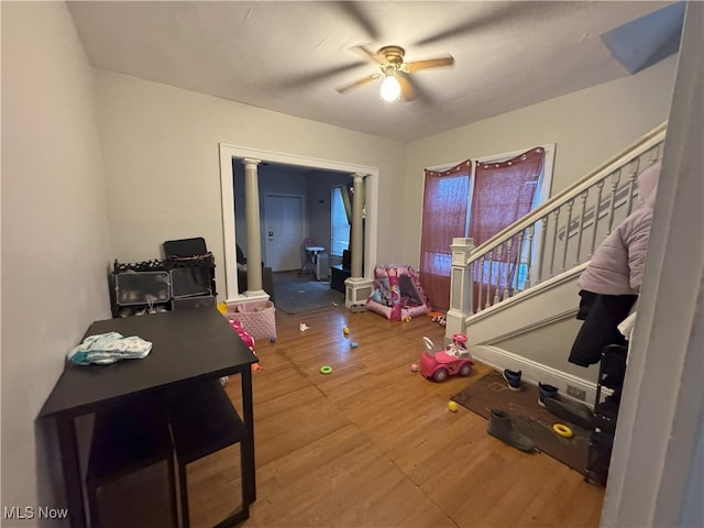 entrance foyer with ceiling fan and wood-type flooring