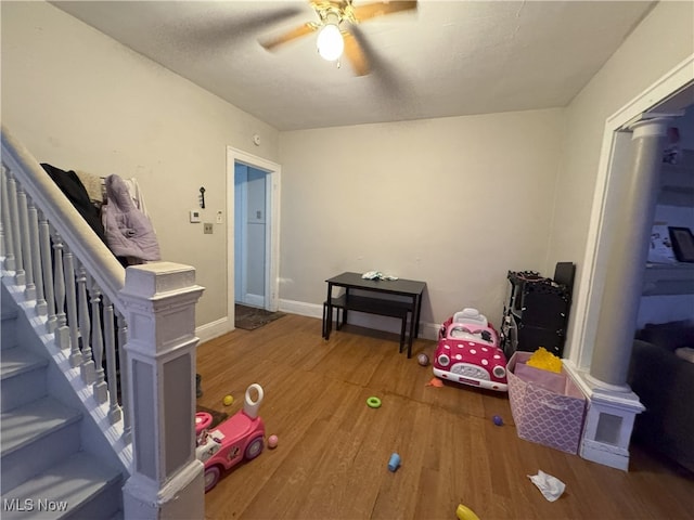 game room with wood-type flooring and ceiling fan